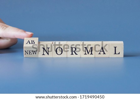 The word of new normal and abnormal with human's finger.concept of new normal behavior after Coronavirus Covid-19 concept. Royalty-Free Stock Photo #1719490450