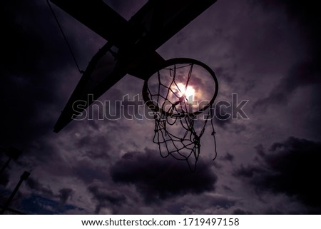 Silhouette of basketball hoop with nice sky background.