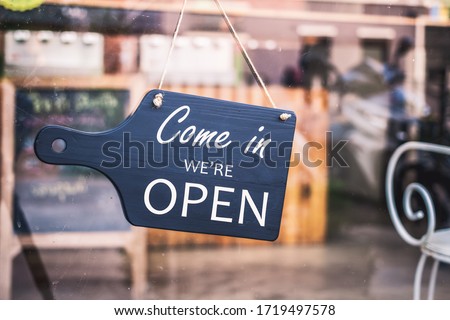 Come in we're open, vintage black retro sign in restaurant