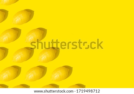 Monochrome pattern of lemon on a yellow background. 