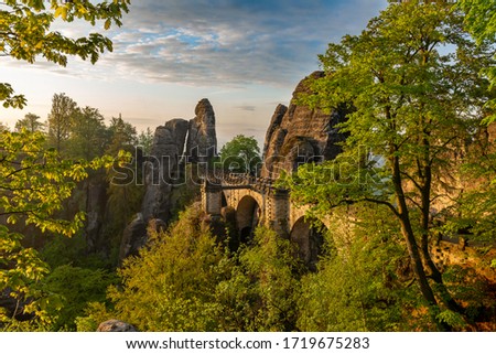 a beautiful view of the bridge of the Bastei of Rathen in saxon switzerland while the sun is rising, Germany