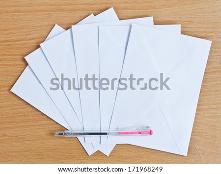 Blank envelope isolated on wood background
