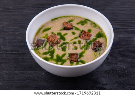 Cream soup with grenels, served with sauce