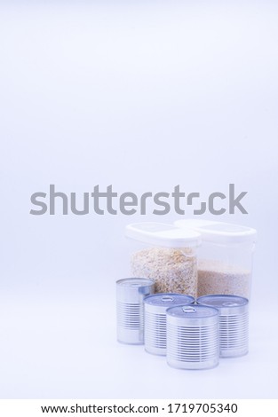 Donation set with oatmeal and canned food. Food supplies, food stock for quarantine, isolation period on white. Donation, coronavirus
