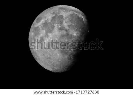 Picture of moon taken through a telescope. It shows a great contrast between the one true light in the night sky.