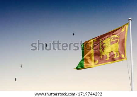 Sri Lankan flag with sky background