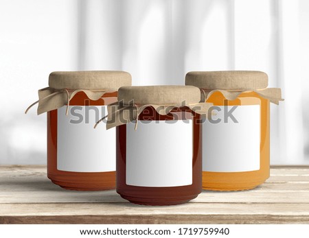 
Various jars of honey on a wooden background