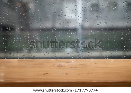 empty table with rainy window