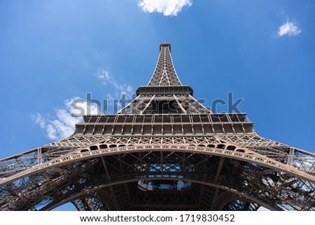 Eiffel Tower in Paris on Blue Sky Background. France. Bottom View. Best Destination in Europe. 