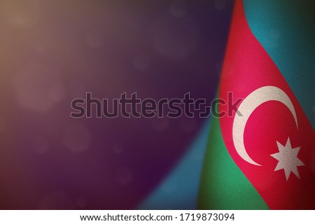 Azerbaijan hanging flag for honour of veterans day or memorial day on blue dark velvet background. Azerbaijan glory to the heroes of war concept. Royalty-Free Stock Photo #1719873094