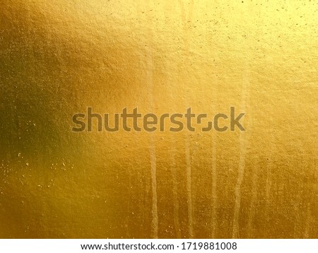 Gold or foil cement wall texture background 
