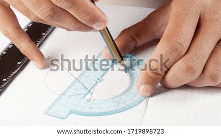 ruler pencil protractor on a  school notebook