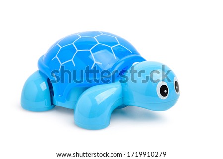 Blue plastic turtle toy isolated on white background. Clipping path.