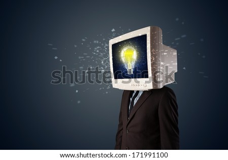Business man with a pc monitor head and idea light bulb glowing in the display