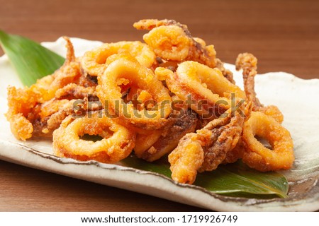 deep fried squids on a plate Royalty-Free Stock Photo #1719926749