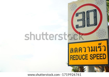 Sign reduce speed ,white background. Thailand Language.