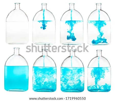 set of blue ink solutions in water in glass flask isolated on white background