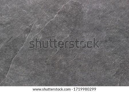 Black rough stone surface. Texture background. Royalty-Free Stock Photo #1719980299