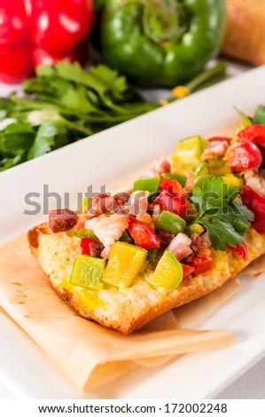 Baguette bread stuffed with meat and peppers.Selective focus on the front side of bread