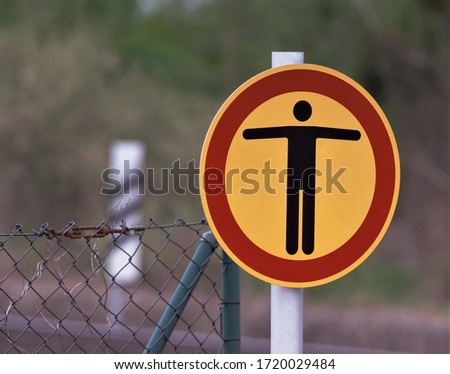 a sign to stop people from entering a working or dangerous area