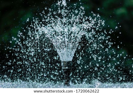 artesian fountain in park, in hot day Royalty-Free Stock Photo #1720062622