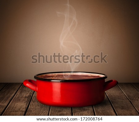cooking pot on old wooden table
