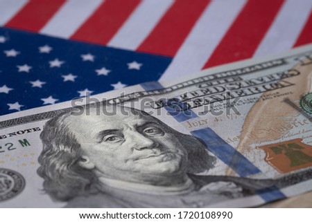 USA economic become a crisis because of virus outbreak. US dollar banknote on USA national flag. Royalty-Free Stock Photo #1720108990