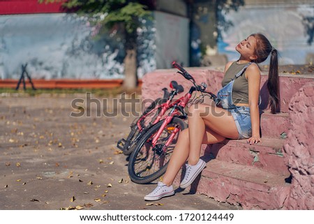 A woman rest after cycling.
