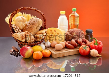 Set of tasty groceries on mirrored table.  Royalty-Free Stock Photo #172014812