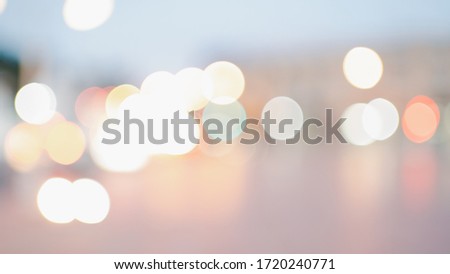 abstract background of blurred warm lights with cool blue and purple background with bokeh effect