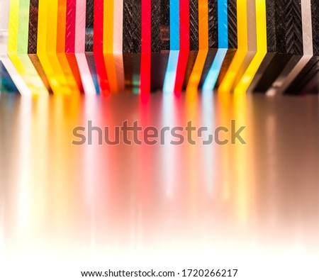 light through Stack of different colours Cast Acrylic Sheet on white background