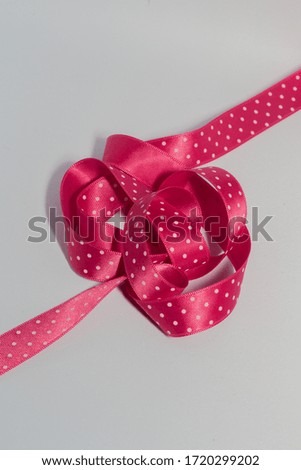 Pink Polka Dot Ribbon tangled in a Mess