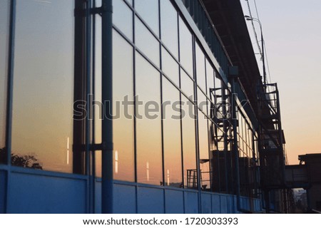 Urban sunrise. Light on the metal bridge.