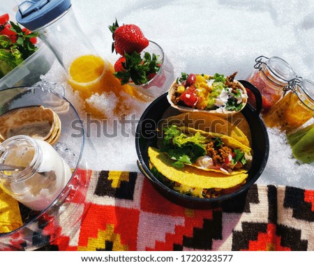 Picnic on​ snow​ with Mexican taco food