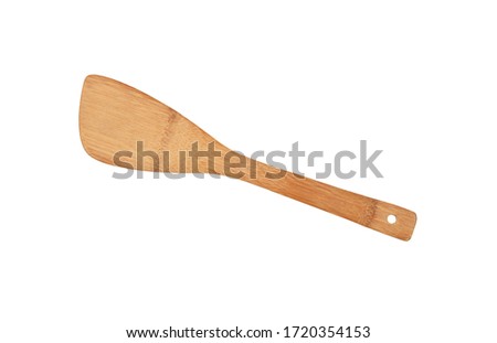 Close up one wooden spatula, natural cooking kitchen utensil of palm wood, isolated on white background, elevated top view, directly above Royalty-Free Stock Photo #1720354153