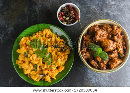 Mashed raw Jackfruit curry or stir fry with beef curry Kerala South India made of tropical jack fruit. Top view Chakka Puzhukku and meat dish, banana leaf plate dark background. Staple food Bangladesh