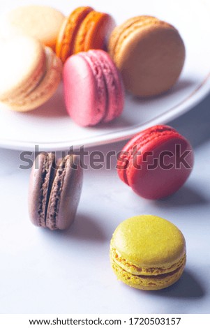 Different colored Macaroons stacked  high