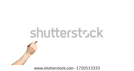 male hand with marker write on an isolated white background. Writing hand. Hand holding black Pen. Wide image.