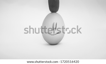Egg with a smile,black and white picture,close-up,chicken egg with cheerful emotion.