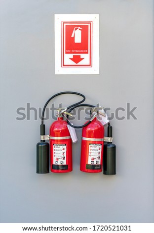 Two fire extinguishers were mounted on the wall for use in the event of a fire situation.