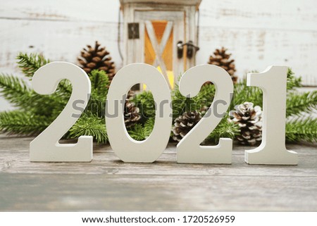 2021 Happy New Year with christmas lantern decorative with space copy on wooden background