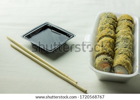 Hot rolls with some utensils and a white background