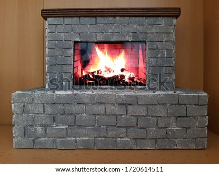 Fire in the hearth of the fireplace