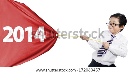 Little businessman is pulling a big new year banner isolated on white