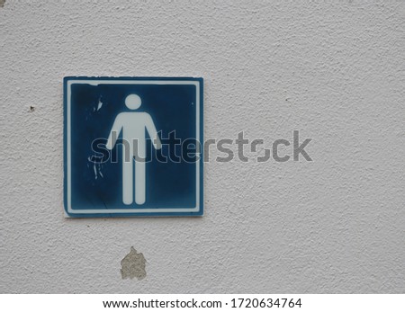 Male sign on the wall