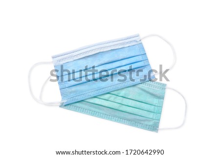 Blue and green medical mask isolate on white background Royalty-Free Stock Photo #1720642990