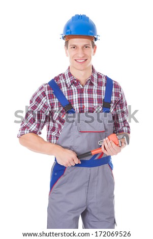 Happy Worker Holding Toolkit And Wrench Over White Background