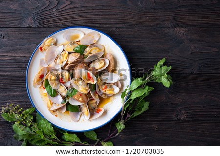 Stir fried Spicy Clam ,Surf clam, with Thai Holy Basil With  Steamed Rice , Asian Food Royalty-Free Stock Photo #1720703035