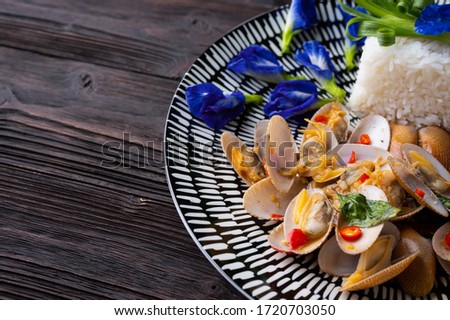 Stir fried Spicy Clam ,Surf clam, with Thai Holy Basil With  Steamed Rice , Asian Food 