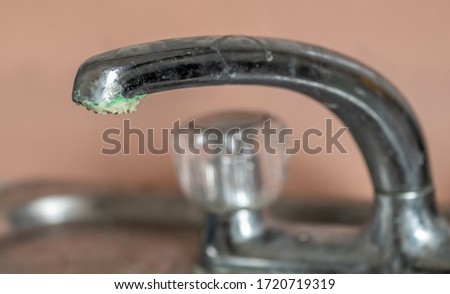 corrosion and limescale on a chrome tap Royalty-Free Stock Photo #1720719319